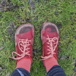 A pair of battered and muddy shoes at the end of a Half Marathon