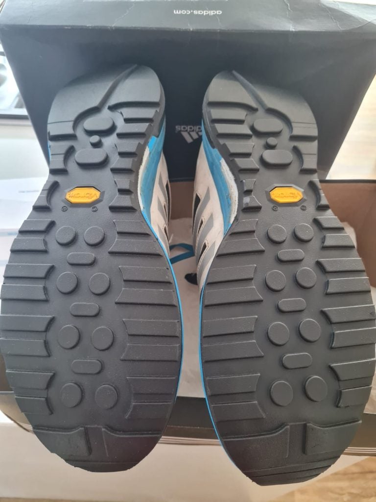 A pair of shoes with a brand new outsole